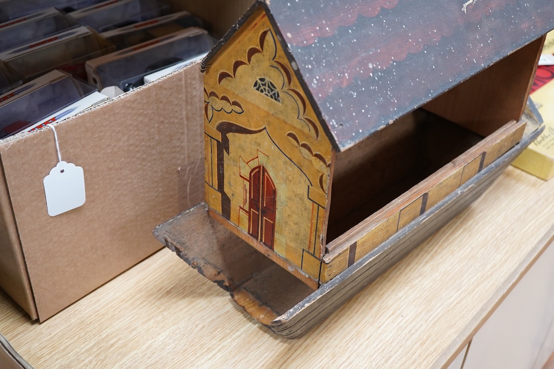 A 19th century German Erzgebirge pine painted Noah's Ark together with a good quantity of carved and painted wooden animals, the ark decorated with trompe l’oeil architectural features, geometric patterns, Gothic windows